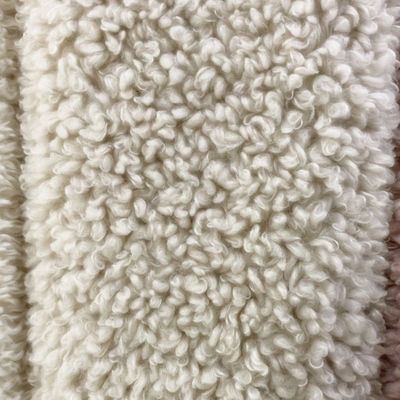 Tejido de piel rizada artificial 100% poliéster para prendas de cualquier color