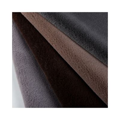 Material de fachada 100% poliéster Tejido de piel falsa de peluche para abrigo de diseño personalizado